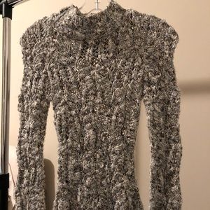 Bebe sweater openings throughout entire sweater
